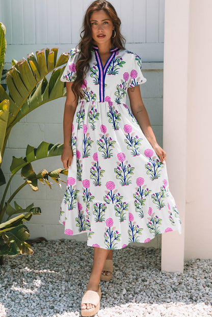 Vestido maxi blanco floral con mangas abullonadas cortas, escote en V y cintura alta
