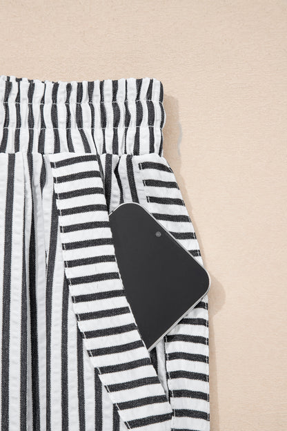 Pantalones casuales negros de pernera ancha con raya