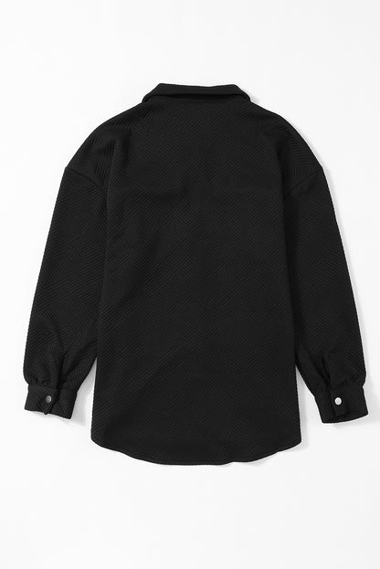 Chaqueta sólida negra texturizada con solapa y botones