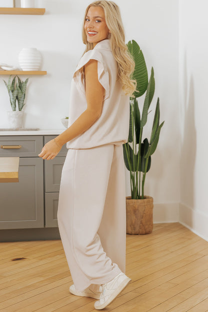 Conjunto de top con cremallera, mangas con volantes y textura de albaricoque y pantalones de pierna ancha