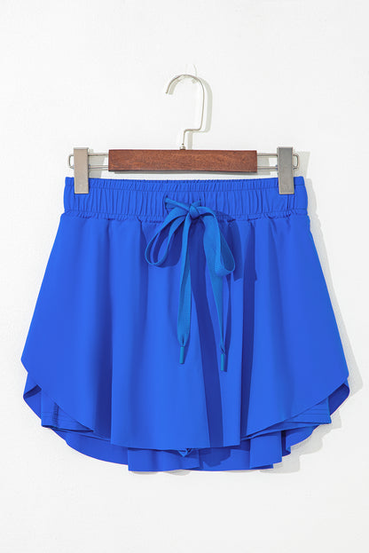 Faldas pantalón de tenis forradas, azul cielo, con cintura elástica con cordón