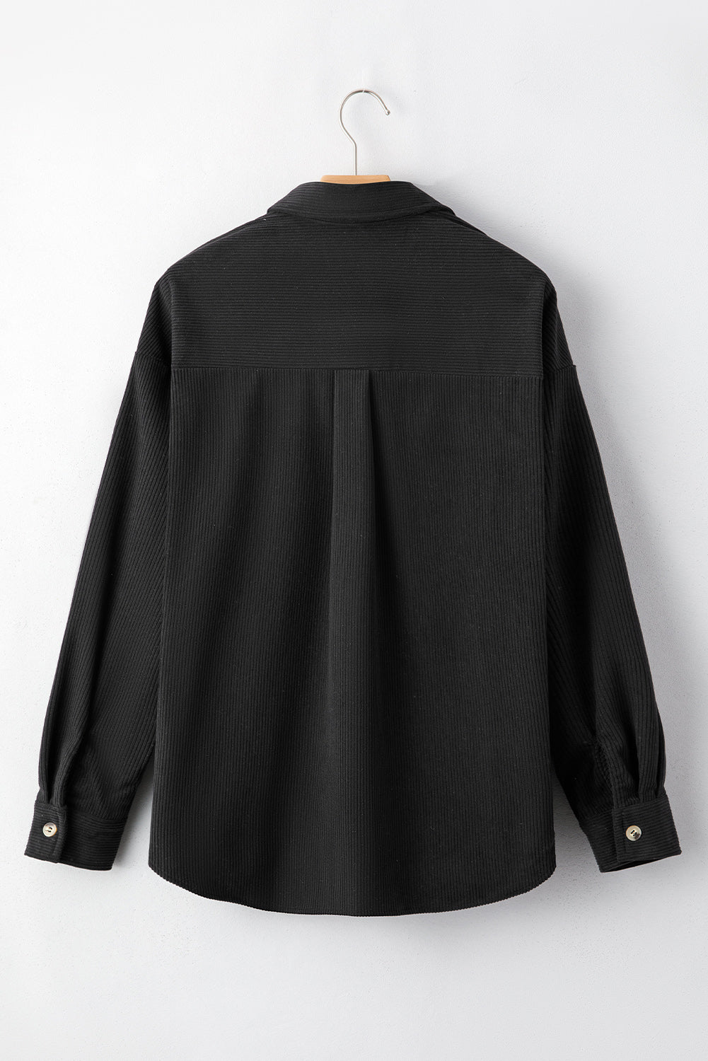 Sobrecamisa negra de pana con diseño de pata de gallo y bolsillos con solapa