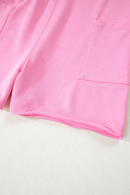 Mameluco suelto rosa de color sólido con bolsillo y dobladillo sin rematar de media manga