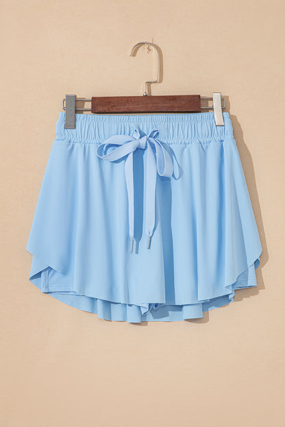 Faldas pantalón de tenis forradas, azul cielo, con cintura elástica con cordón
