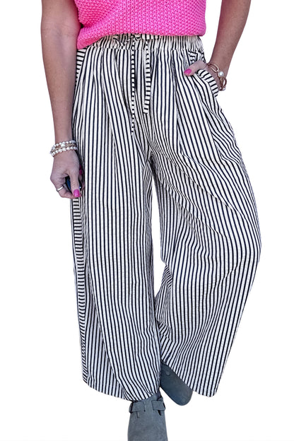 Pantalones casuales negros de pernera ancha con raya