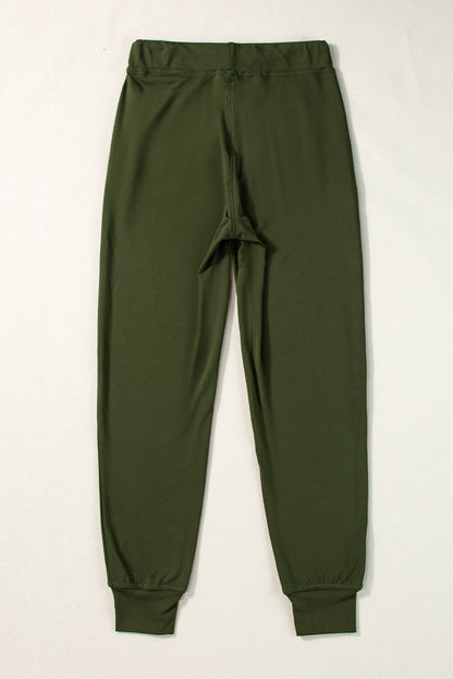 Pantalón jogger con cordón, cintura elástica y bolsillos, color verde musgo