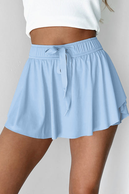 Faldas pantalón de tenis forradas, azul cielo, con cintura elástica con cordón