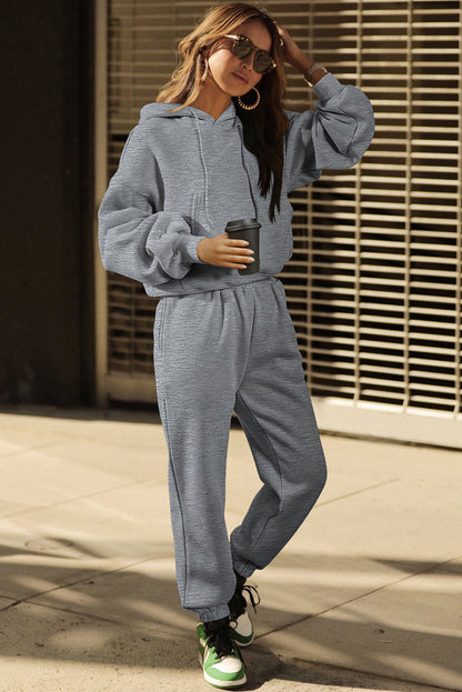 Conjunto deportivo de sudadera con capucha de hombros caídos y joggers, color gris liso