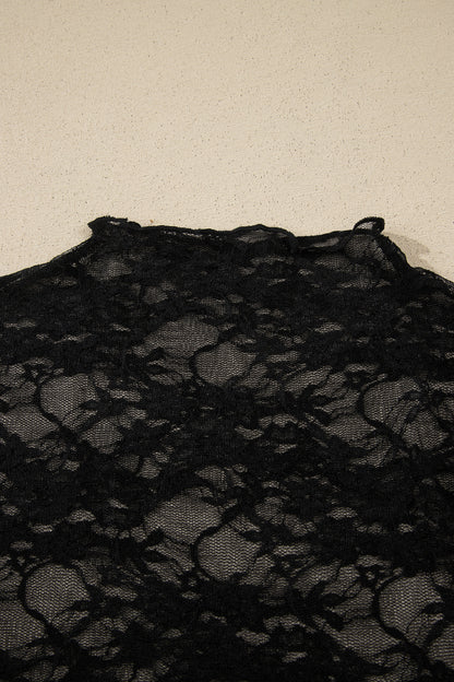 Top de manga larga de encaje floral semitransparente negro con cuello simulado y dobladillo ondulado