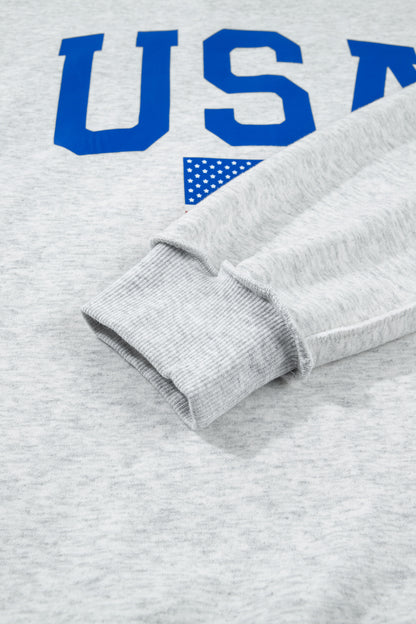 Sudadera gris claro con cuello simulado y gráfico reversible de EE. UU./América