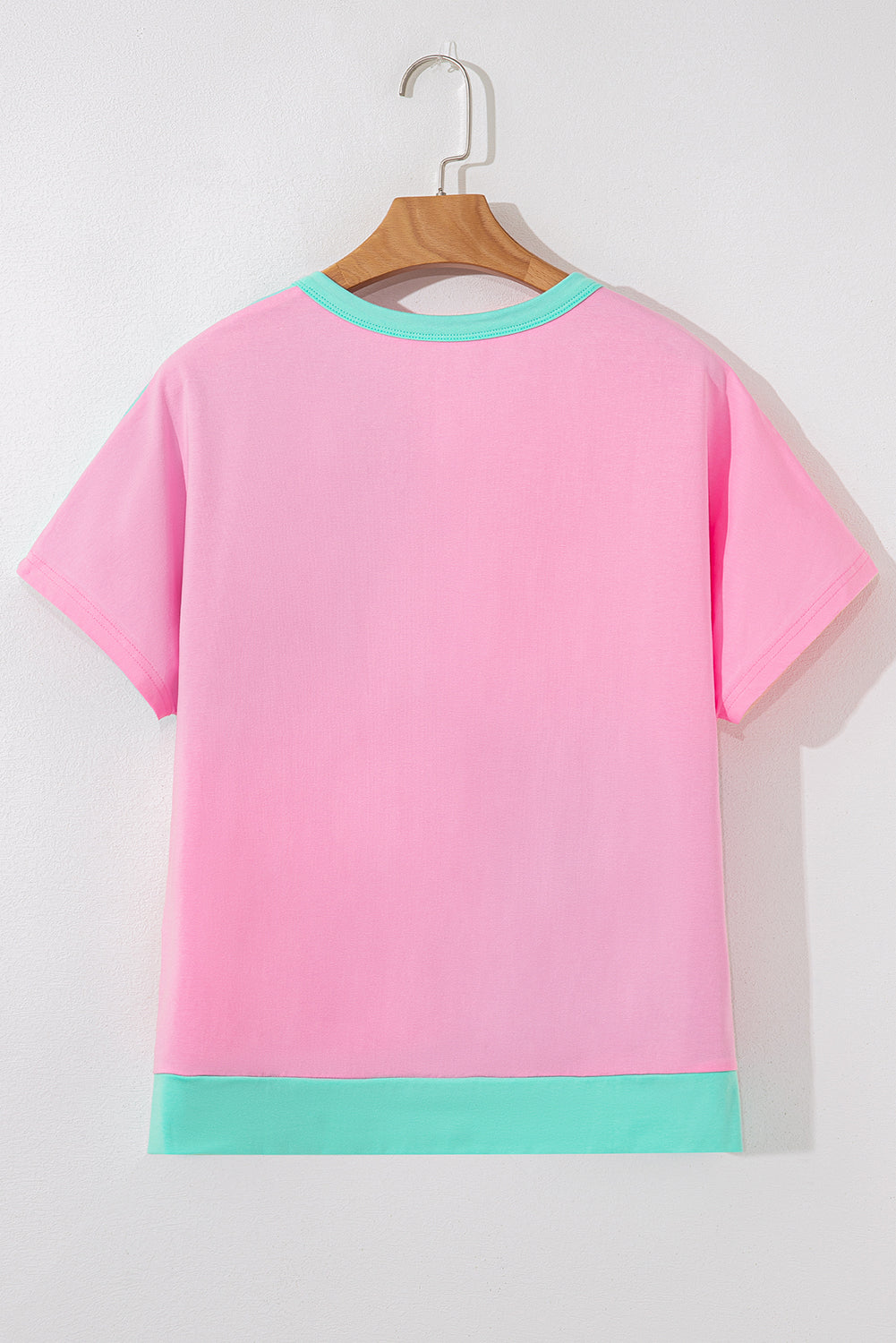 Camiseta con cuello y medio abotonado, dos tonos verde menta