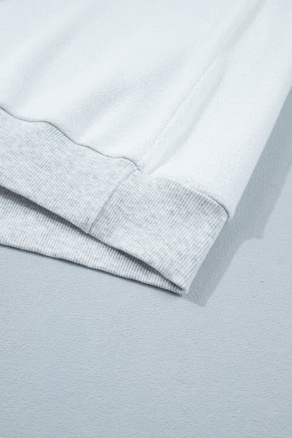 Sudadera gris claro con cuello simulado y gráfico reversible de EE. UU./América