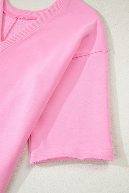 Mameluco suelto rosa de color sólido con bolsillo y dobladillo sin rematar de media manga