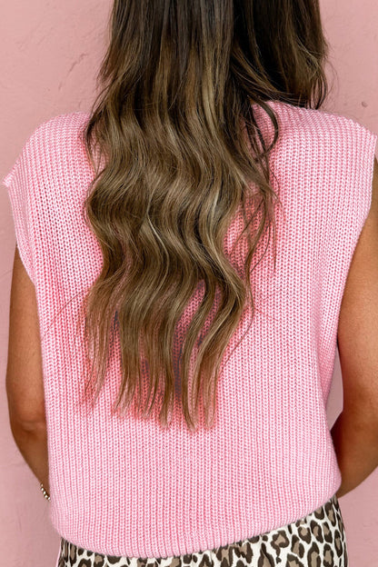 Chaleco de punto rosa liso con cuello de pico y botones en la parte delantera