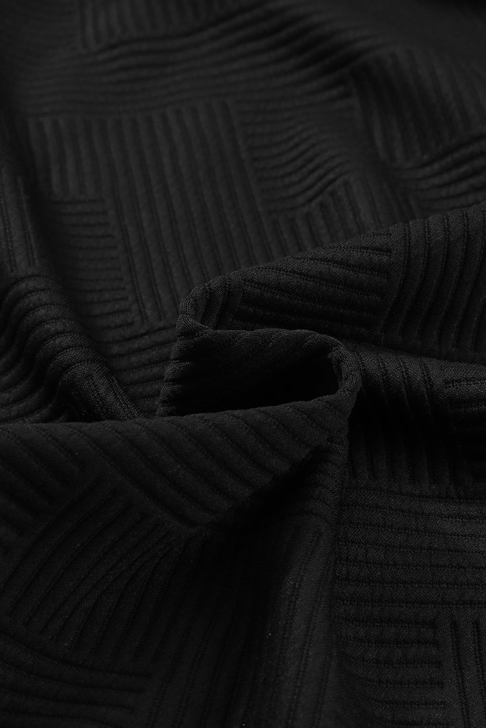 Chaqueta sólida negra texturizada con solapa y botones