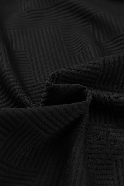 Chaqueta sólida negra texturizada con solapa y botones