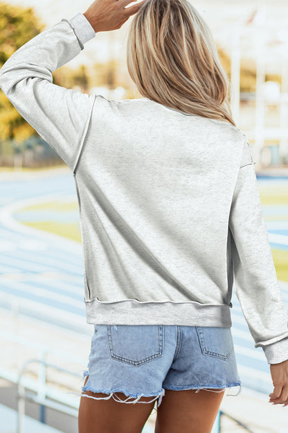 Sudadera gris claro con cuello simulado y gráfico reversible de EE. UU./América