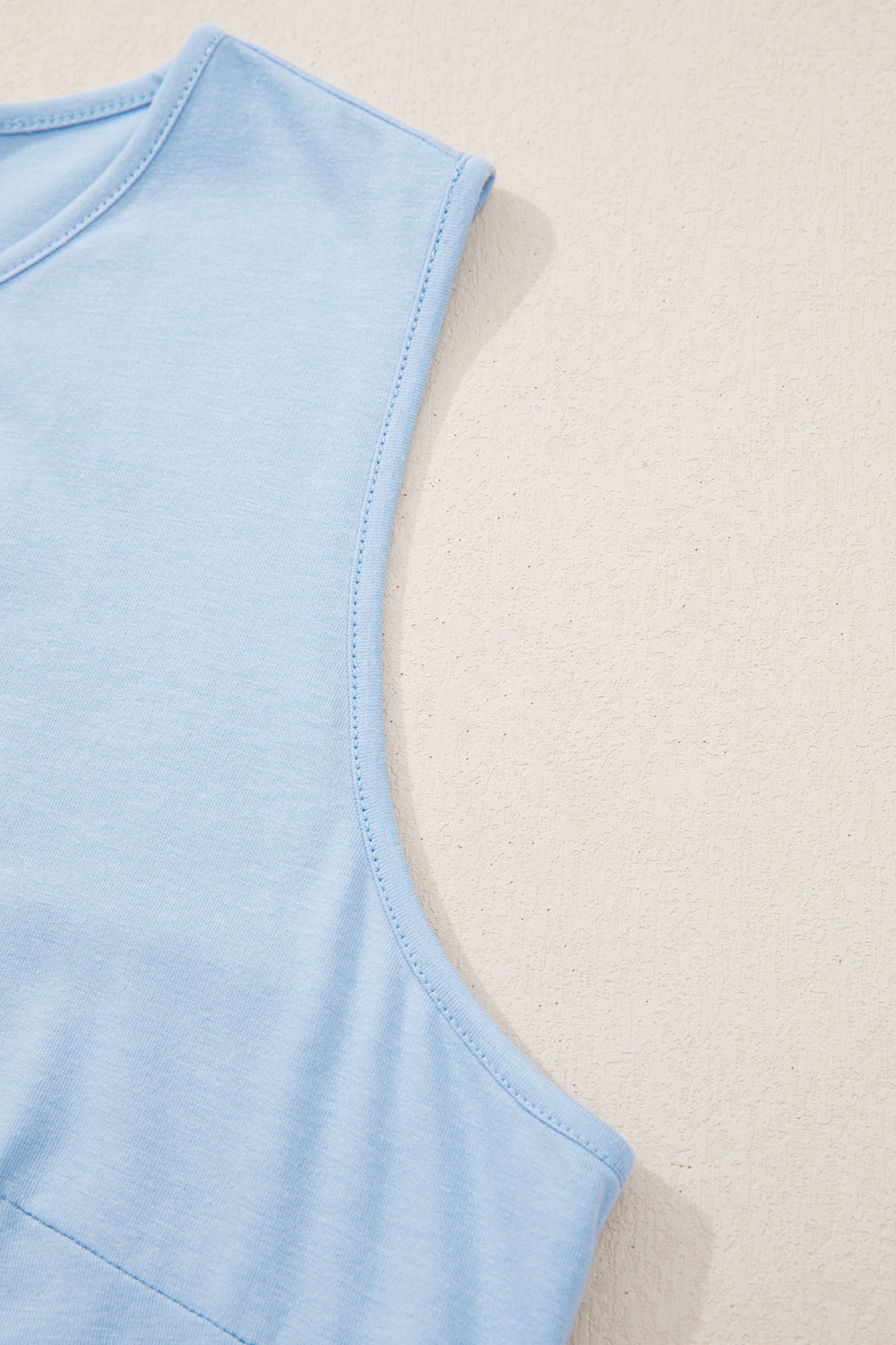 Beau Blue Talla Grande Color Sólido Lazo Peplum Blusa Sin Mangas