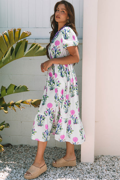 Vestido maxi blanco floral con mangas abullonadas cortas, escote en V y cintura alta