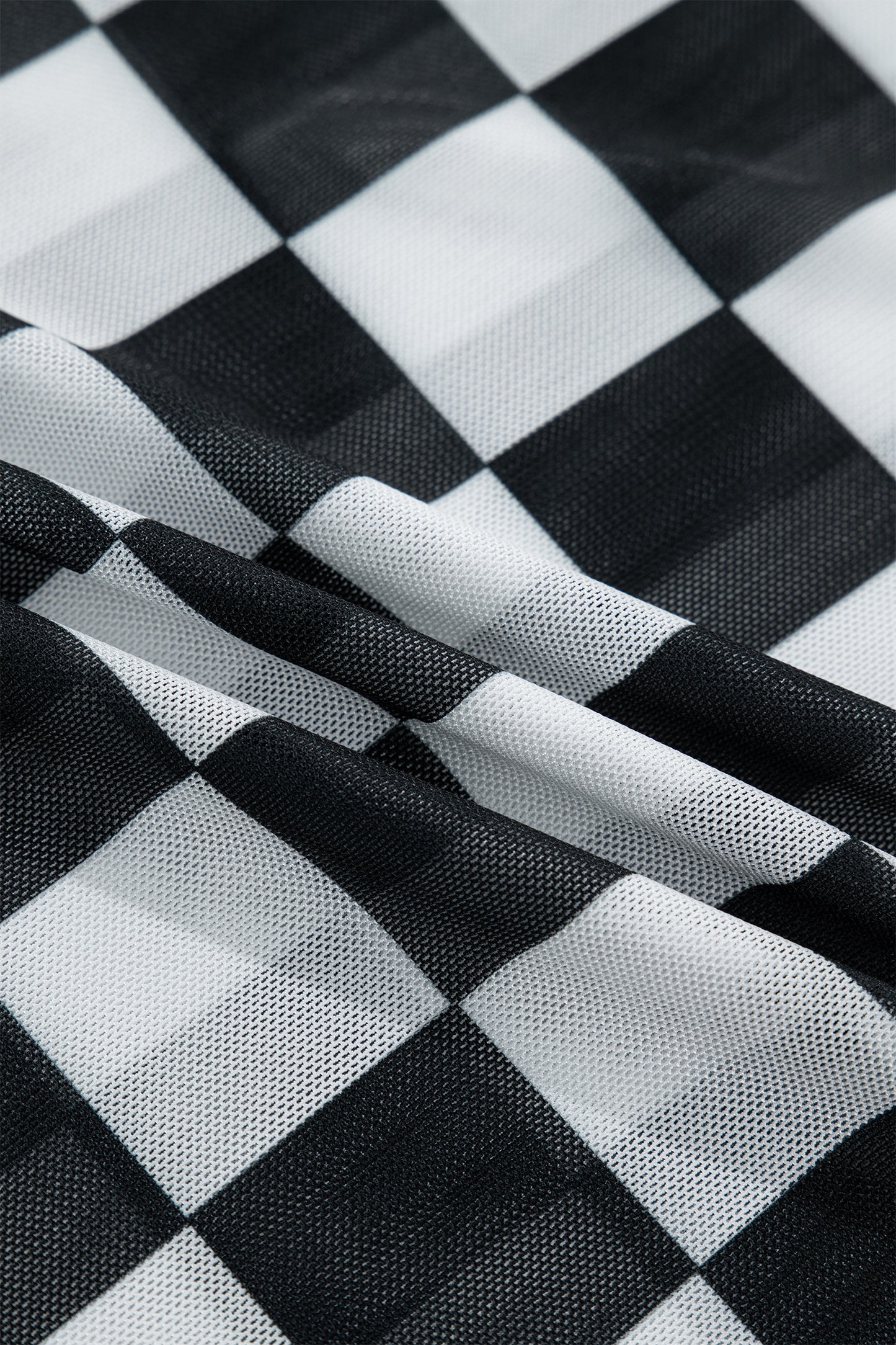 Camiseta sin mangas ajustada con tirantes finos y estampado a cuadros transparente en negro
