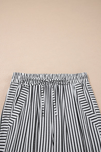 Pantalones casuales negros de pernera ancha con raya